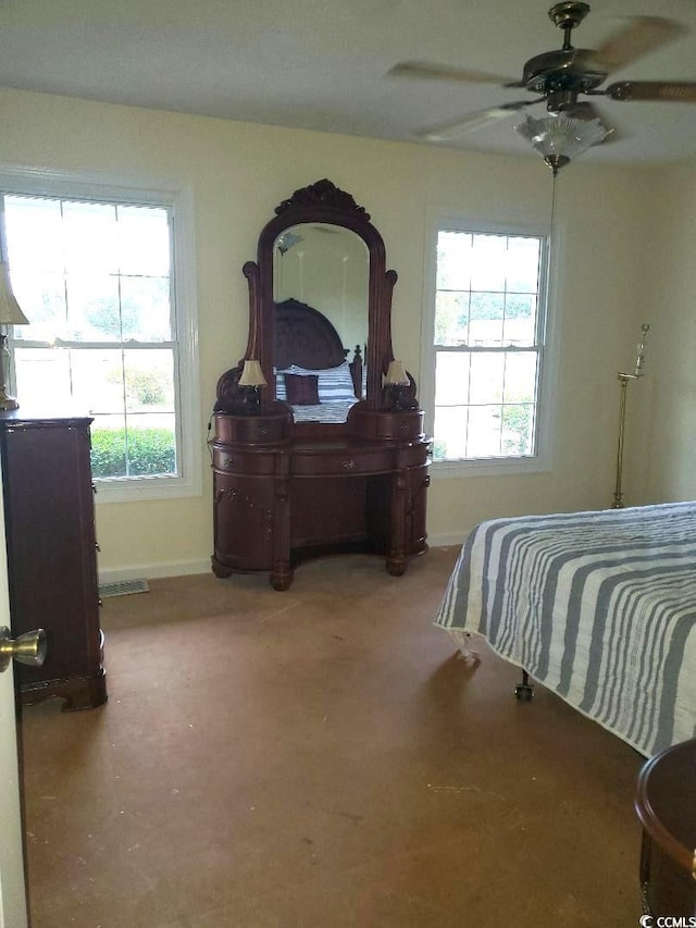 5864 Crestwood Dr, Myrtle Beach, SC 29578 - bedroom featuring multiple windows, a ceiling fan, and carpet floors