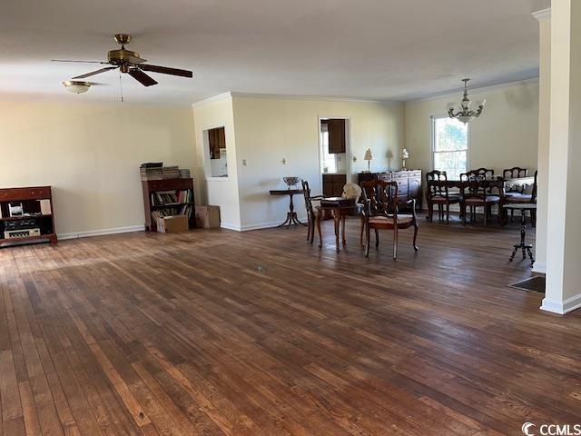 5864 Crestwood Dr, Myrtle Beach, SC 29578 - dining area featuring a chandelier, hardwood / wood-style flooring, ornamental molding, and a ceiling fan