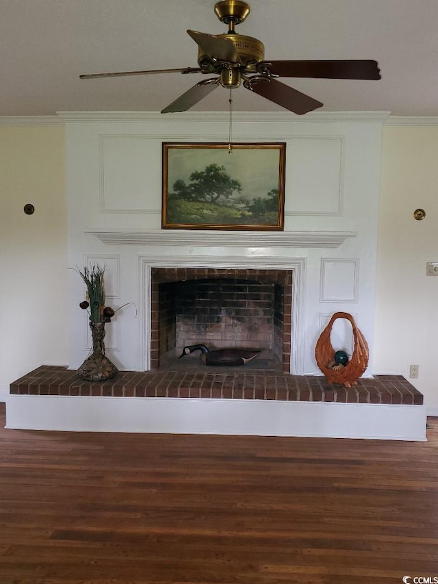 5864 Crestwood Dr, Myrtle Beach, SC 29578 - detailed view of crown molding, wood finished floors, ceiling fan, and a fireplace