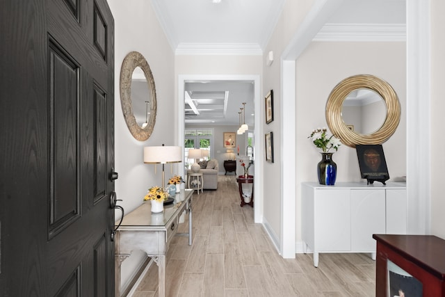 foyer with beamed ceiling, light wood-type flooring, coffered ceiling, and crown molding