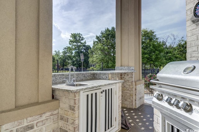 view of patio / terrace with area for grilling, sink, and grilling area