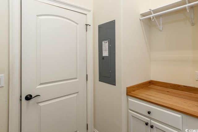 laundry area with electric panel