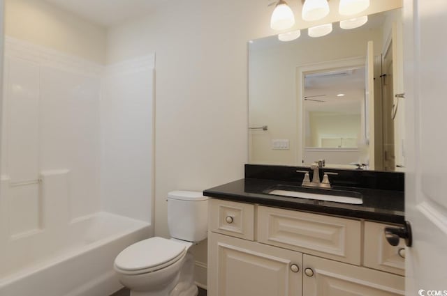 full bathroom featuring bathtub / shower combination, vanity, and toilet