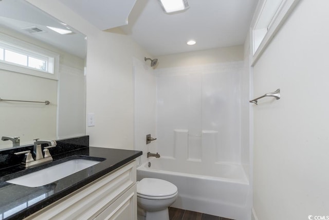 full bathroom with shower / washtub combination, toilet, wood-type flooring, and vanity