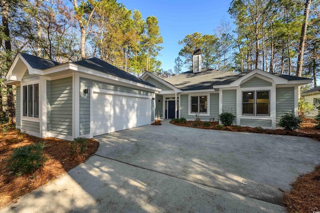 single story home with a garage