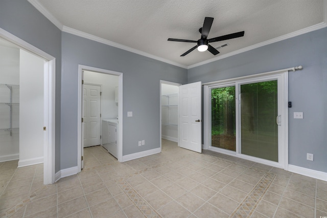 unfurnished bedroom featuring ceiling fan, light tile patterned floors, independent washer and dryer, a textured ceiling, and connected bathroom