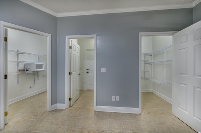 interior space featuring cooling unit, a closet, and ornamental molding