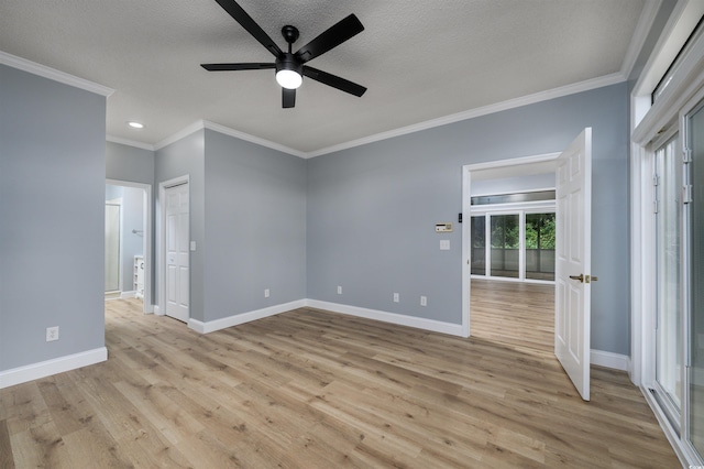 spare room featuring ceiling fan, crown molding, and light hardwood / wood-style flooring