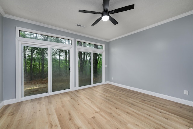 unfurnished room with ceiling fan, crown molding, and a textured ceiling