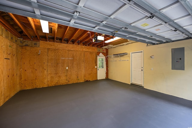 garage with wooden walls, a garage door opener, and electric panel