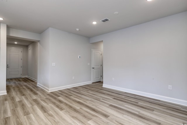 spare room featuring light hardwood / wood-style flooring