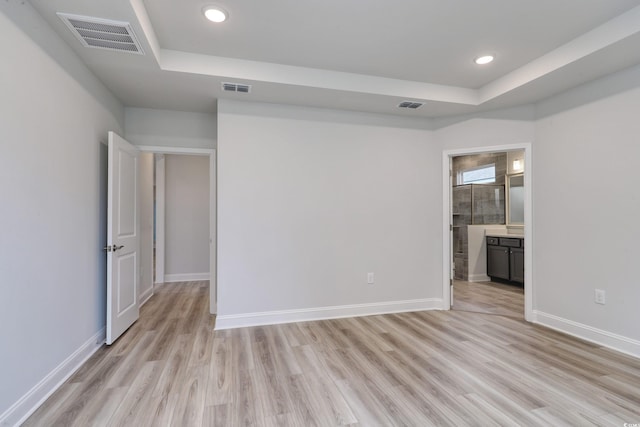 spare room with light wood-type flooring