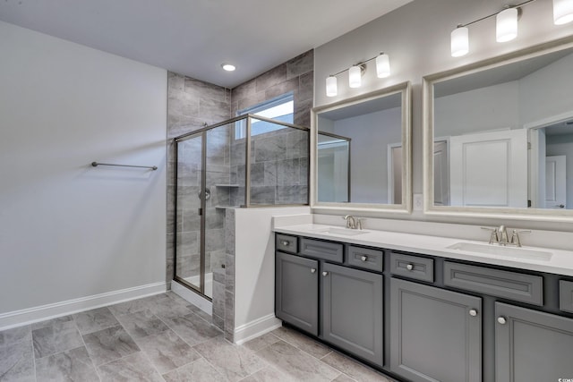 bathroom featuring vanity and a shower with shower door