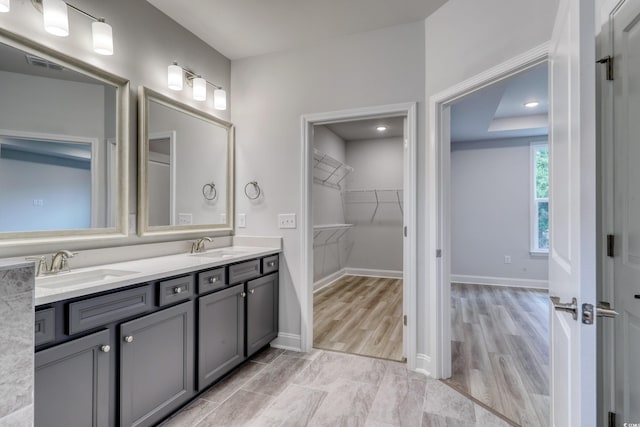 bathroom featuring vanity and wood-type flooring