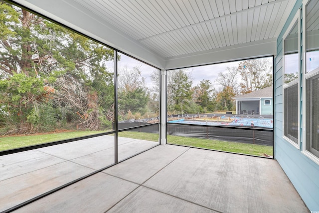 unfurnished sunroom featuring a healthy amount of sunlight