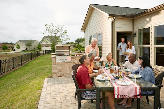 view of patio with an outdoor kitchen