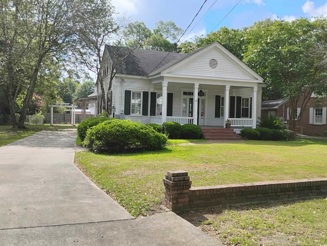 view of front of house with a front lawn and a porch