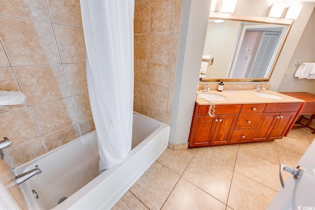 bathroom with tile patterned flooring, vanity, and shower / bathtub combination with curtain