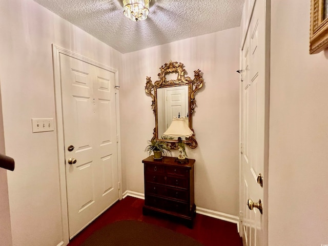 entryway with a textured ceiling