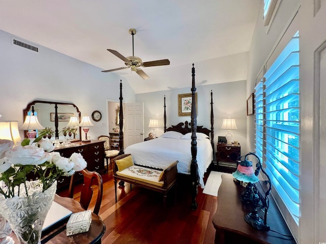 bedroom featuring hardwood / wood-style floors, ceiling fan, and lofted ceiling