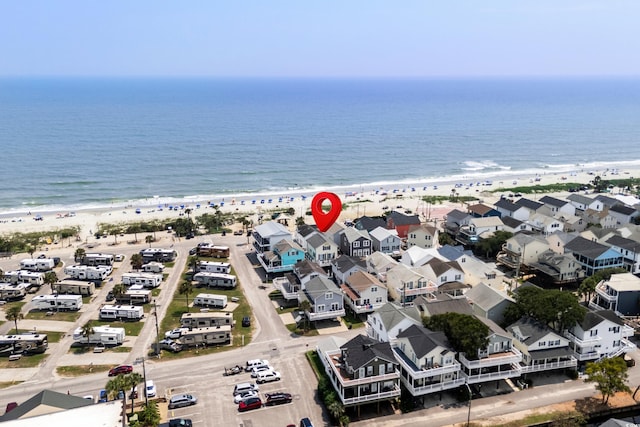 bird's eye view with a view of the beach and a water view