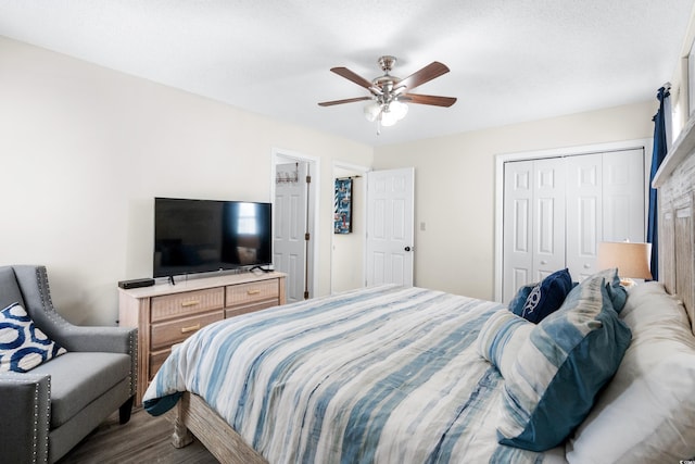 bedroom featuring hardwood / wood-style floors, a closet, and ceiling fan