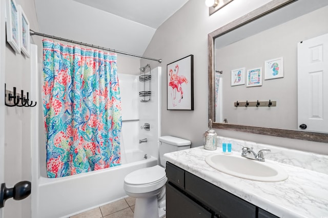 full bathroom featuring lofted ceiling, shower / bath combination with curtain, vanity, toilet, and tile patterned floors