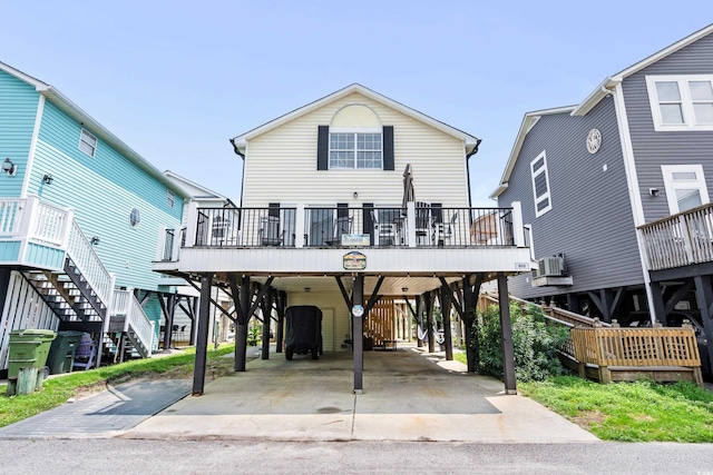 view of front of home featuring a wooden deck and a carport