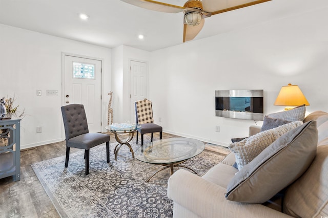 living room with hardwood / wood-style floors and ceiling fan