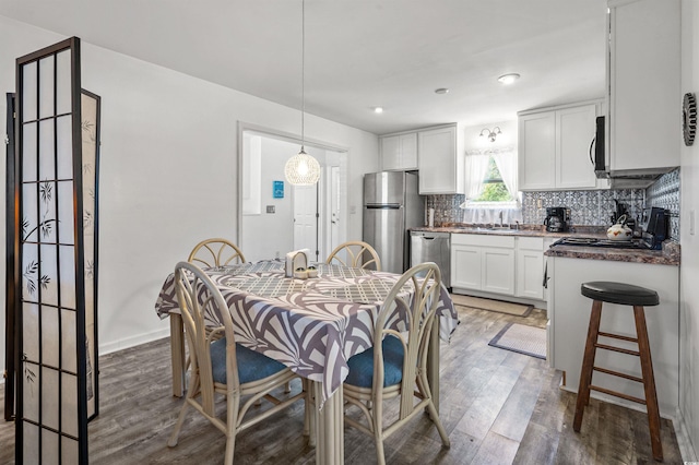 dining area with dark wood-type flooring