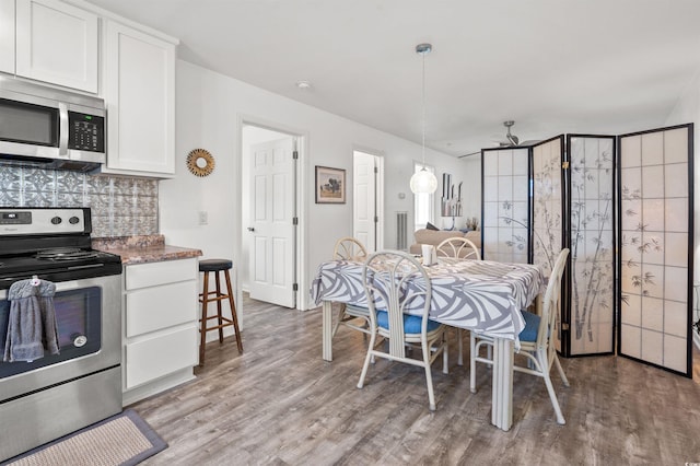 dining area featuring hardwood / wood-style flooring