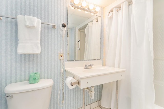 bathroom featuring sink and toilet