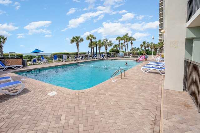 view of swimming pool with a patio area