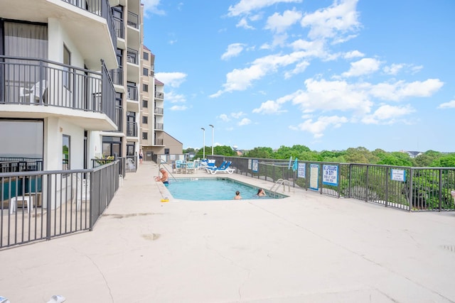 view of swimming pool with a patio area