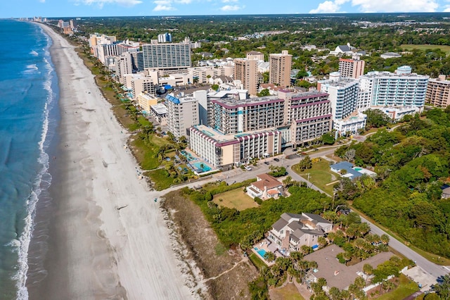 aerial view with a water view and a beach view