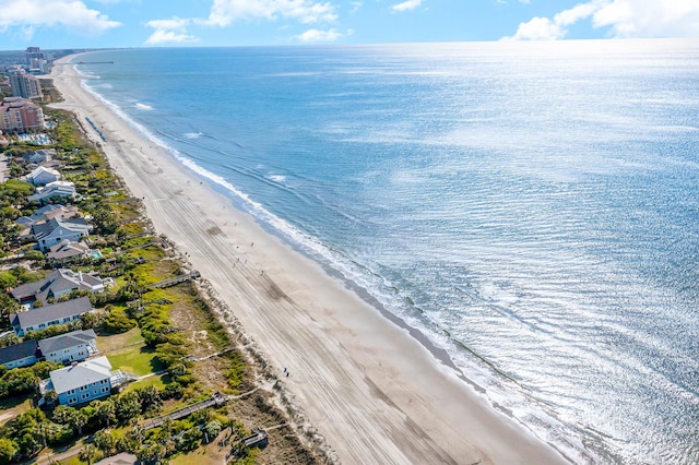 bird's eye view featuring a water view and a view of the beach