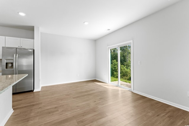 unfurnished living room featuring light hardwood / wood-style flooring