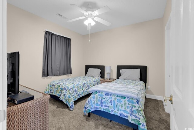 4709 Wild Iris Dr Unit 104, Myrtle Beach, SC 29577 - bedroom featuring carpet, a ceiling fan, and baseboards
