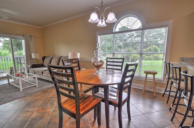 tiled dining area with an inviting chandelier and crown molding