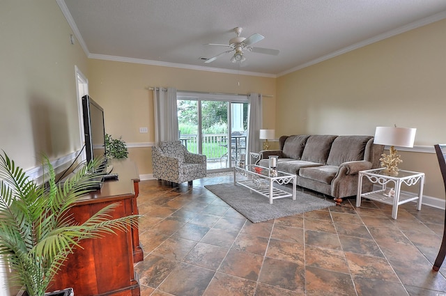 living room featuring ornamental molding, a textured ceiling, baseboards, and a ceiling fan