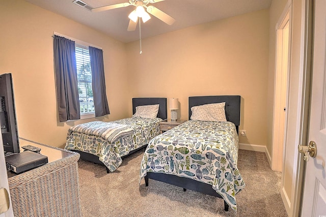 bedroom featuring ceiling fan, carpet, visible vents, and baseboards