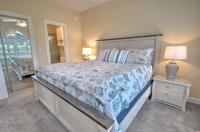 carpeted bedroom featuring baseboards