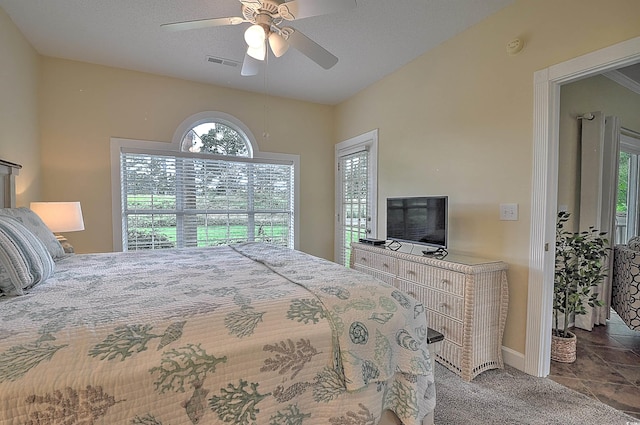 bedroom featuring ceiling fan and tile patterned floors