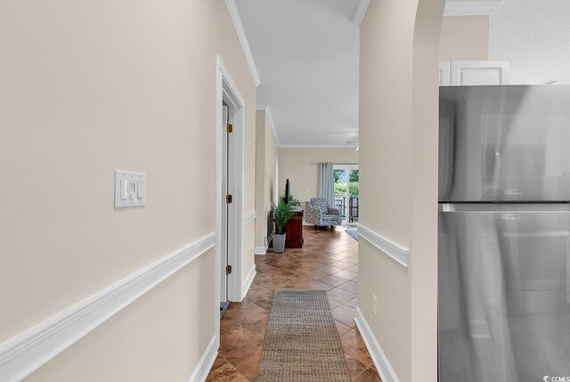 4709 Wild Iris Dr Unit 104, Myrtle Beach, SC 29577 - hallway featuring crown molding, arched walkways, and baseboards