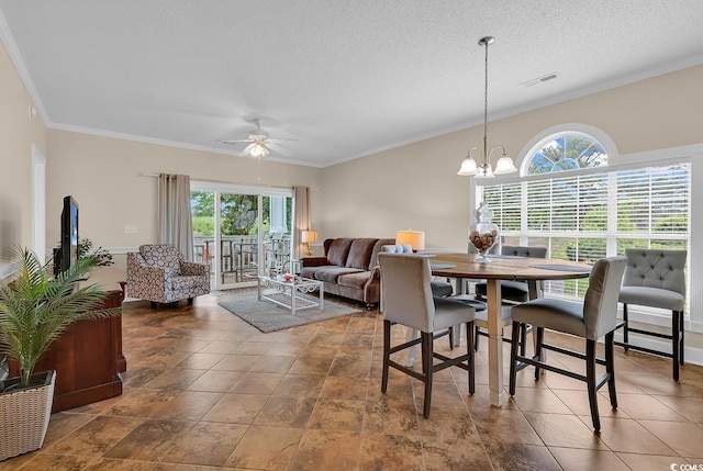 4709 Wild Iris Dr Unit 104, Myrtle Beach, SC 29577 - dining space featuring healthy amount of natural light, ornamental molding, ceiling fan, a chandelier, and a textured ceiling