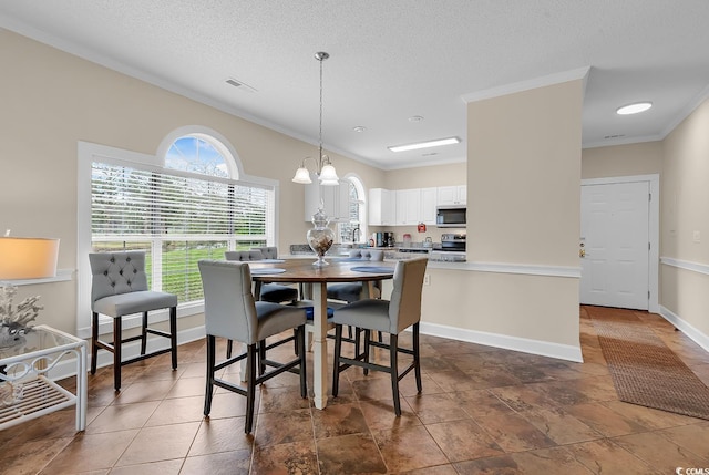 4709 Wild Iris Dr Unit 104, Myrtle Beach, SC 29577 - dining area with crown molding, baseboards, and a textured ceiling