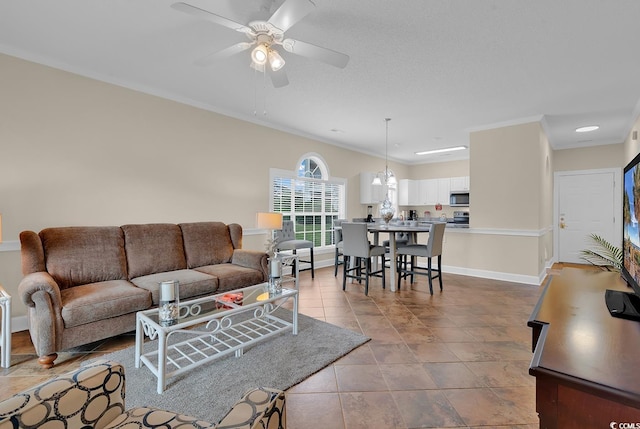 4709 Wild Iris Dr Unit 104, Myrtle Beach, SC 29577 - living room featuring ornamental molding, a ceiling fan, and baseboards