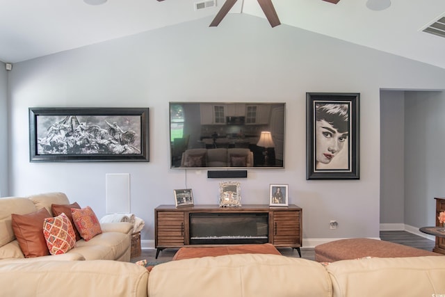 living room with lofted ceiling, wood-type flooring, and ceiling fan