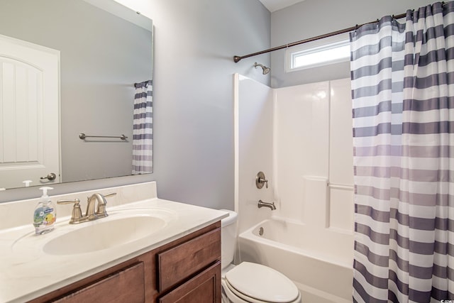 full bathroom with vanity, shower / bath combination with curtain, and toilet