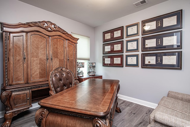 office space with dark hardwood / wood-style flooring